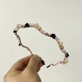 Detail of wavy pink headband featuring crystal beads and black rose charms - Pink