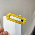 Detail of yellow quilted PU leather BB hair clip with elegant diamond lattice texture - Yellow