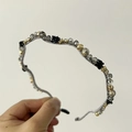 Detail of handcrafted floral headband with gray faceted beads and black fabric flowers - Gray