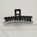 Detail view of a 13cm black claw clip with heart-shaped rhinestones and measuring ruler - Black