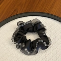 Detailed close-up of handmade black satin scrunchie with smoky grey crystal bead trim - Black with Gray Beads