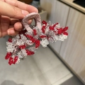 Elegant handmade star stone hair claw clip with red and white beads for bun styling - Floral New Year Red