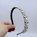 Dettaglio di strass argentati e nappe a foglia su una fascia per capelli di lusso - Stile Strass Marquise E Ovale (A款)
