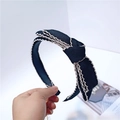 Elegante cerchietto in maglia nera con pizzo bianco e grande fiocco in mano - Nero