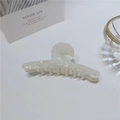 Detail view of a pearlescent white acetate hair claw clip with a glossy iridescent finish - 10cm / Hanger Style Barrette