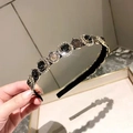 Detail view of retro watch-themed headband with crystals and vintage metal ornaments - Black Gemstone Clock Style