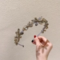Elegant crystal flower headband with rhinestones and gold metal base in soft grey - Gray