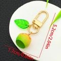 Realistic lime keychain with translucent leaf and golden hook on a white display - Green Style (ER1496)