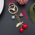 Handmade cherry and pearl keychain with gold metal clasp for bag accessories - Red Resin Cherry Peach Pearl Style (ER1854)