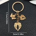 Porte-clés ailes d'ange et croix dorée sur fond de cuir noir texturé élégant - Style Ange Ailes Croix Or KC (ER1877)