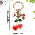 Goldener Kirsch- und Erdbeeren-Anhänger Schlüsselanhänger mit roten Kristallen - Rot Emaille Strass Kirsche Erdbeere