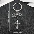 Antiek zilveren sleutelhanger met kruis hart en zon op zwart lederen basis - Antiek Zilver Kruis Hart Zon Sleutelhanger (ER1882)