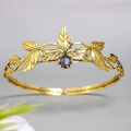 Vintage golden leaf crown with engraved textures and center purple gemstone inlay - Antique Gold