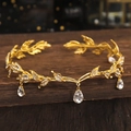 Detailed view of vintage gold laurel leaf crown with crystal teardrop pendants - Gold