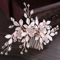 Rose gold leaf and flower bridal hair comb with shimmering crystals on dark wood - Hair Comb / Rose Gold