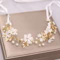 Elegant bridal hair vine with white flowers, gold leaves and pearls on champagne box - White