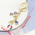 Independence Day keychain with heart sunglasses, cupcake, and pearls in red, white, and blue - Rhinestone Glasses & Pearl (ER1664)