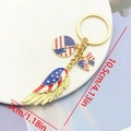 USA flag themed keychain with Statue of Liberty and enamel butterfly on a white tray - Liberty Statue & Wings (ER1656)
