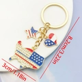USA theme keychain with rhinestone map, heart and star charms on golden alloy base - Rhinestone Map (ER1661)
