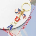Golden USA flag keychain with red white blue enamel letters and sparkling rhinestones - USA & Liberty Statue (ER1657)