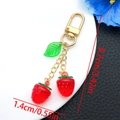 Detailed view showing strawberry pendant dimensions 8.7cm total length and 1.4cm fruit width - Transparent Red Leaf Strawberry