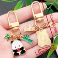 Panda keychain with green bamboo pendant in golden metal, size 5.5cm/2.16in total - Panda Chewing Apple Style (ER1128)