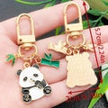Cute panda and bamboo metal keychain with gold D-ring buckle and enamel finish - Panda Chewing Bamboo Style (ER1129)