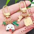 Cartoon panda keychain with green bamboo leaf charm and golden metal D-ring buckle - Huahua Panda Style (ER1132)
