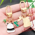 Cute panda and bamboo metal keychain with gold plating and size dimensions - Panda with Pink Flower Style (ER1133)