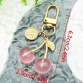 Detail view of pink cherry keychain with gold leaf and letter T charm showing dimensions - Creamy Yellow Letter T (ER1596)