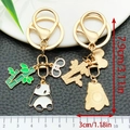 Panda and bamboo metal keychain with golden finish and colorful enamel coating - Angry Panda Style (ER1204)