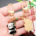 Cute panda bamboo metal enamel keychain variant with dimensions 6.5cm height - Panda Holding Long Bamboo Style (ER1179)