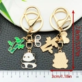 Panda and bamboo keychain set with golden metal finish and enamel details - Baby Panda Style (ER1210)