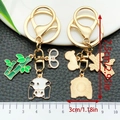 Panda metal keychain with green bamboo charms and lobster clasp for backpack decor - Straw Hat Panda Style (ER1213)