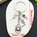 Porte-clés cowboy vintage argenté avec revolver, chapeau et bottes charms de 7.8cm - Argent Antique Bottes de Cowboy Western Chapeau (ER1256)