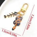 Portachiavi gatto tartarugato con ciondolo a lisca di pesce nera e metallo oro - Ciondolo Gatto Tartarugato Lisca di Pesce (LS565)