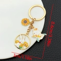 Close-up of golden sunflower and rabbit enamel pendants with size measurements - Yellow Enamel Sunflower Rabbit (ER1717)