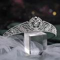 Detailed view of silver bridal crown with intricate rhinestones on velvet background - Silver Style (HG674)