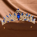 Elegant gold bridal crown with brilliant blue gemstones and crystals on silk background - Gold Royal Blue