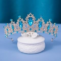 Baroque bridal crown with sky blue rhinestones and gold metal on blue velvet surface - Gold Base Lake Blue Rhinestone