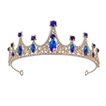 Close-up of golden bridal tiara with sparkling blue gemstones and clear rhinestones - Gold Blue