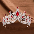 Macro view of silver baroque crown featuring red teardrop crystals and clear rhinestones - Silver Red