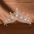 Detailed view of Baroque gold crown with large marquise rhinestones on a satin background - Small Gold