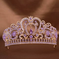 Macro shot of gold bridal crown with purple rhinestones on brown silk background - Gold Base Purple Rhinestone