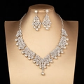 Detailed view of luxury bridal jewelry set with sparkling rhinestones and white pearls - Silver Pearl Style