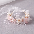 Macro shot of handmade bridal headband with pink flowers, pearls and golden leaves - Pink Bracelet