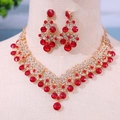 Elegant bridal jewelry set with red rhinestone necklace and drop earrings in gold finish - Red Rhinestone Beaded
