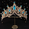 Golden bridal crown with marquise sky blue stones and white crystals on black background - Gold Base Lake Blue Rhinestone