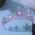 Close-up of gun black tiara with pink rhinestones and pear-cut purple gemstones - Antique Purple