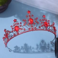 Macro detail of gothic style crown with pear-shaped red rhinestones on black metal frame - Antique Red